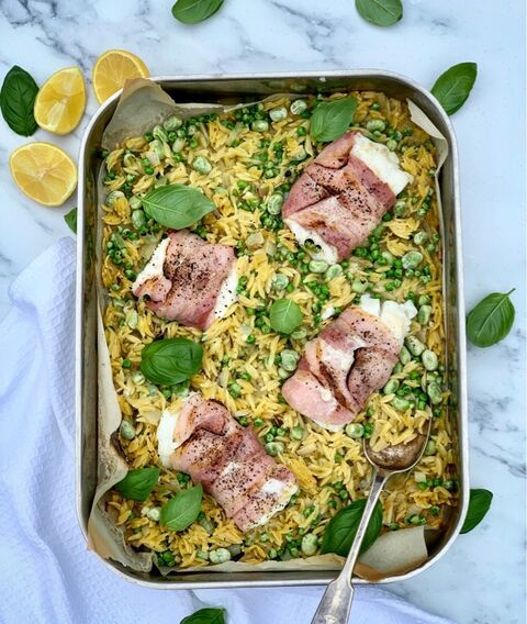 Cod Wrapped in Bacon, with Pea, Broad-bean & Orzo Traybake